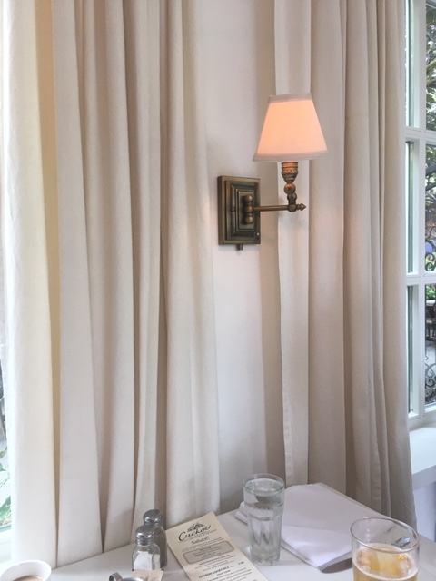 Curtains and tablecloths add a rustic feel.